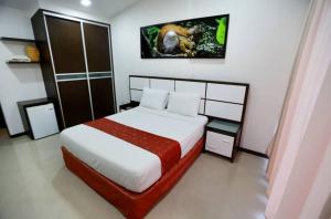 Ένα ή περισσότερα κρεβάτια σε δωμάτιο στο Posada Villa del Carmen