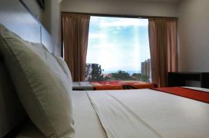 Katil atau katil-katil dalam bilik di Posada Villa del Carmen