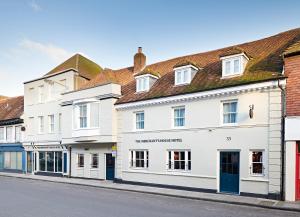 a row of white buildings on a street at The Merchant's House, BW Signature Collection in Salisbury