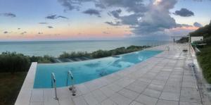 The swimming pool at or close to Stunning Design Villa with unique 180º sea views