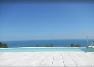 The swimming pool at or close to Stunning Design Villa with unique 180º sea views