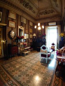 a living room filled with furniture and a window at Casato Lioy in Ripacandida