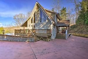 a home with a large porch with a deck at Spacious Lake Santeetlah Cottage with Lake Views! in Santeetlah