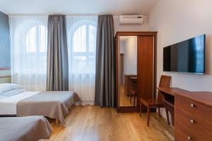 Postel nebo postele na pokoji v ubytování Hotel Villa Wesset