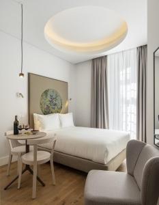 Ένα ή περισσότερα κρεβάτια σε δωμάτιο στο Lisbon Serviced Apartments - Madalena