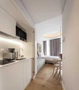 Η κουζίνα ή μικρή κουζίνα στο Lisbon Serviced Apartments - Madalena