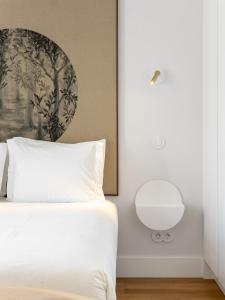 Ένα ή περισσότερα κρεβάτια σε δωμάτιο στο Lisbon Serviced Apartments - Madalena
