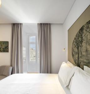 Ένα ή περισσότερα κρεβάτια σε δωμάτιο στο Lisbon Serviced Apartments - Madalena