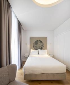Ένα ή περισσότερα κρεβάτια σε δωμάτιο στο Lisbon Serviced Apartments - Madalena