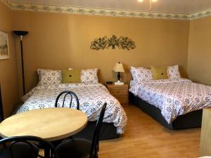 Ένα ή περισσότερα κρεβάτια σε δωμάτιο στο Motel Des Cascades