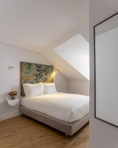 Ένα ή περισσότερα κρεβάτια σε δωμάτιο στο Lisbon Serviced Apartments - Madalena