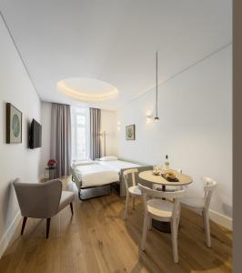 Ένα ή περισσότερα κρεβάτια σε δωμάτιο στο Lisbon Serviced Apartments - Madalena