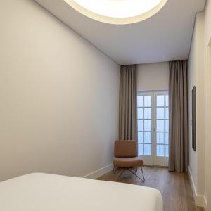 Ένα ή περισσότερα κρεβάτια σε δωμάτιο στο Lisbon Serviced Apartments - Madalena