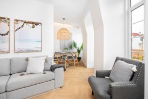 a living room with a couch and a chair at WHome | Luxury Duplex Prime Location Great for Families in Lisbon