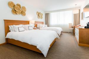 Rúm í herbergi á Hotel Melia Lima