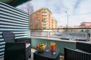 a table with a bowl of fruit on a balcony at Piccolo Hotel Boutique in Rome