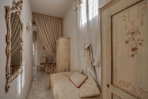 a small bedroom with a bed and a window at Florence Dream Domus in Florence