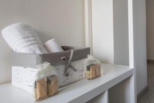 Rúm í herbergi á Piccolo Hotel Boutique