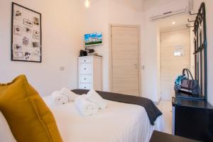 Rúm í herbergi á Piccolo Hotel Boutique