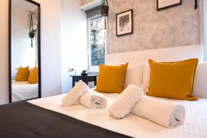 Rúm í herbergi á Piccolo Hotel Boutique