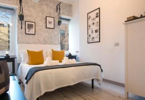 Rúm í herbergi á Piccolo Hotel Boutique