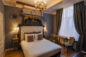 Postel nebo postele na pokoji v ubytování Boutique Hotel Huys van Leyden