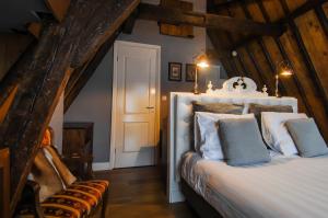 Postel nebo postele na pokoji v ubytování Boutique Hotel Huys van Leyden