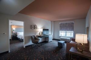 a hotel room with a bed and a desk at Holiday Inn Lexington - Hamburg, an IHG Hotel in Lexington