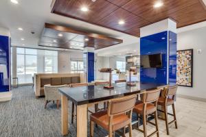 an office with a large table with chairs and a couch at Holiday Inn Express & Suites - Denton South by IHG in Denton