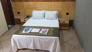 מיטה או מיטות בחדר ב-Millenium Hotel