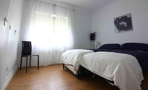 Posteľ alebo postele v izbe v ubytovaní Villas Aloha Valdelagrana