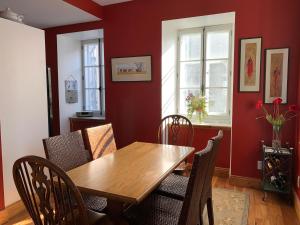 a dining room with a wooden table and chairs at Artillery view Condo (free parking) in Quebec City