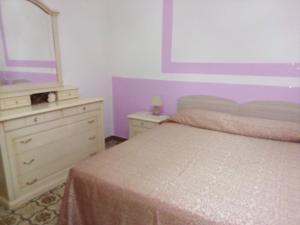 Katil atau katil-katil dalam bilik di ALLOGGIO TURISTICO LA MIMOSA