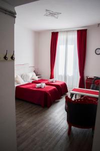 Posteľ alebo postele v izbe v ubytovaní Relais Cola Di Rienzo
