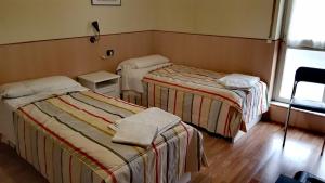 Un pat sau paturi într-o cameră la Affittacamere Metro Fiera