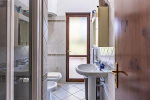 a bathroom with a sink and a toilet at VILLA GIAGGIA - VICINO IL MARE in San Vito lo Capo
