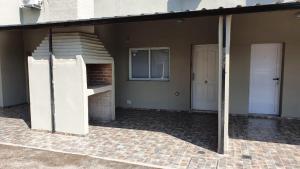 an empty house with a staircase and two doors at Dptos CerBo in Deán Funes