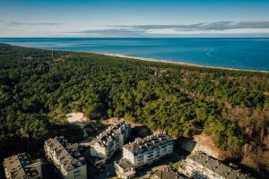 an aerial view of the beach and the ocean at MGM Apartamenty in Ustka