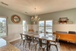 a dining room with a table and chairs at Folly 'B' Golly in Folly Beach