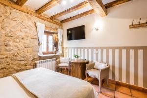 Postel nebo postele na pokoji v ubytování Posada del Rodeno