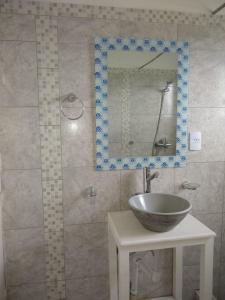 a bathroom with a bowl sink and a mirror at Quijaneando in Campo Quijano