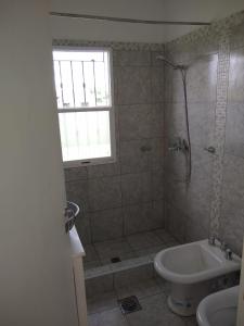 a bathroom with a shower and a toilet and a sink at Quijaneando in Campo Quijano