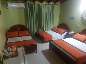 Letto o letti in una camera di Hotel Tequendama