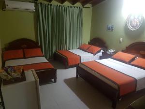 Letto o letti in una camera di Hotel Tequendama