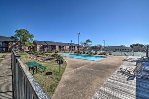 a view of a swimming pool with a wooden deck at Game Day Retreat Pool Access, 2 Mi to Texas A and M in College Station