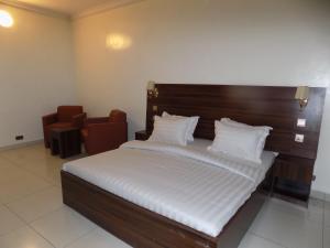 Letto o letti in una camera di Posh Hotel and Suites Victoria Island