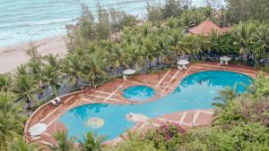 an aerial view of a resort with two pools and the beach at Seava Ho Tram Beach Resort in Ho Coc