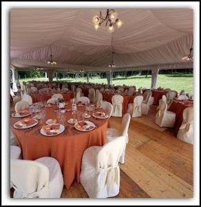 a large tent with a table and chairs in it at Agriturismo La Quercia in Boccheggiano