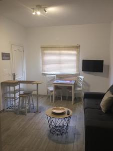 a living room with a couch and a table at Maxorata Town Fuerteventura in Morro del Jable