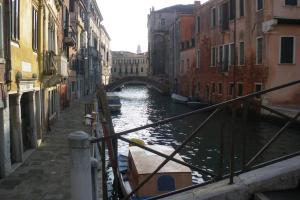 a canal in a city with a bridge and buildings at beautiful house in Venice in Venice